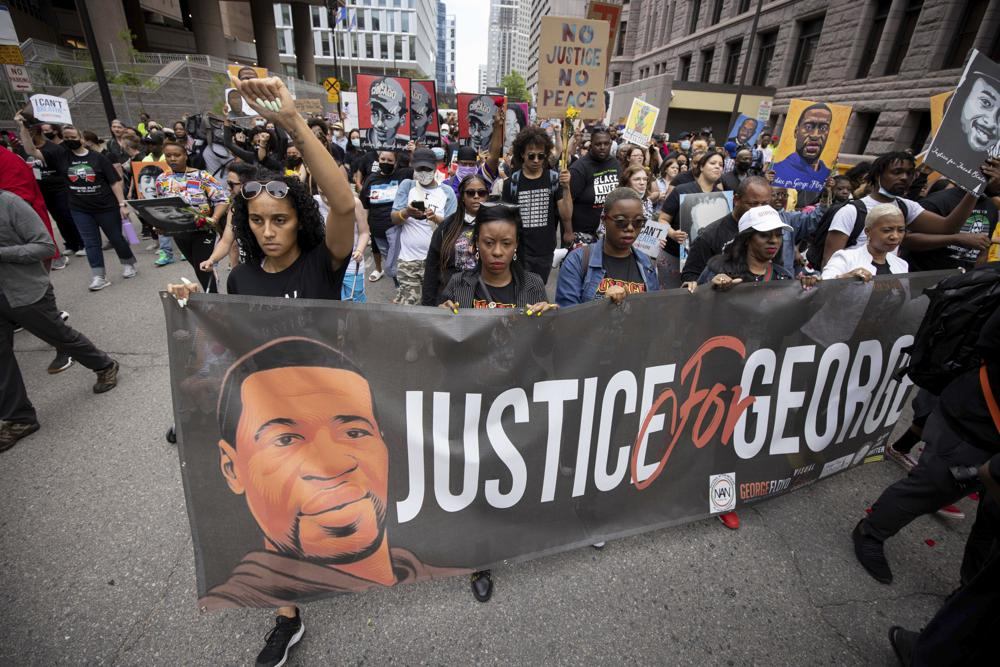 People march for the one year anniversary of George Floyd's death on Sunday, May 23, 2021, in Minneapolis, Minn.